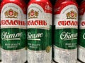 Closeup of beer cans ukrainian Obolon light beer in shelf of german supermarket
