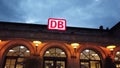 ERLANGEN, DEUTSCHLAND - AUGUST,2020: DB Deutsche Bahn train station.The German railway company logo with people with