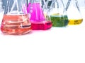 The Erlenmeyer or Conical flask on bench laboratory, with colorful solvent solution from titration experiment. Royalty Free Stock Photo