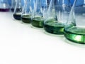 The Erlenmeyer or Conical flask on bench laboratory, with green solvent from forming reaction between boric acid and ammonia. Royalty Free Stock Photo