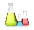 Erlenmeyer flasks with color liquids isolated on white. Royalty Free Stock Photo