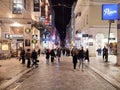 Photo of people walking in Ermou pedestrian street in Athens, Greece at night. Royalty Free Stock Photo