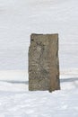 Ernest Shackleton\'s funerary stele under snow, Grytviken cemetery, South Georgia, Antarctica Royalty Free Stock Photo
