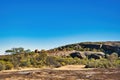 Eroded granite rocks, boulders and stunted outback vegetation, Western Australia