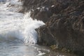 Eroded limestone rock and wave Royalty Free Stock Photo