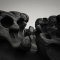 Eroded rock formations with smooth, curved surfaces and large cavities, resembling Royalty Free Stock Photo