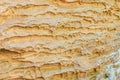 Eroded sandstone rock formation with textured layers in natural setting Royalty Free Stock Photo