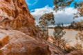 Eroding orange sandstone cliffs. Royalty Free Stock Photo