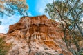 Eroding orange sandstone cliffs. Royalty Free Stock Photo