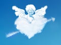 Eros angel looking down from a heart cloud Royalty Free Stock Photo