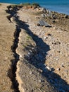 Erosion in the coastal zone. Ground cracking and sliding into the sea.