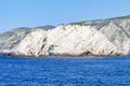 Erosion by the deep blue sea formed a large hole in the rocks along the coast of the island of Zakynthos, Greece Royalty Free Stock Photo