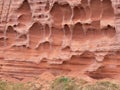 Erosion in the red sandstone coastal cliffs at Budleigh Salterton, Devon, UK. Geology on the Jurassic coast. Royalty Free Stock Photo