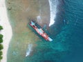 Erotic drone view of a ship stranded on the beach. Royalty Free Stock Photo