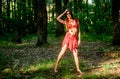 Erotic games. wild woman in forest. fairitale. pocahontas costume woman. amazon instinct. sexy girl in leather clothes