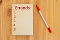 Errands list on retro old paper notepad with marker