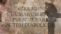 Errare humanum est, perseverare autem diabolicum. A Latin phrase. Royalty Free Stock Photo