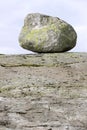 Erratic stone on the granite rock. Royalty Free Stock Photo