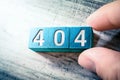 Error Code 404 On Blue Wooden Blocks On A Table, Arranged By A Hand Royalty Free Stock Photo