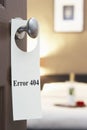 Error 404' sign on hotel room door