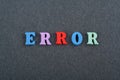 ERROR word on black board background composed from colorful abc alphabet block wooden letters, copy space for ad text Royalty Free Stock Photo