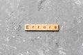 Errors word written on wood block. Errors text on cement table for your desing, concept