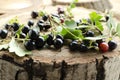 Blackcurrant on the wooden board.Natural fresh summer berries