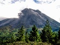 Erupting Arenal Volcano masked in clouds Royalty Free Stock Photo