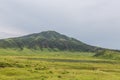 Erupting Mount Aso volcano view from natural trail in Kumamoto, Rice field landscape and arch bridge in Takachiho, Miyazaki, Japan