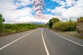 Eruption of the Etna volcano on the horizon of the lonely road on Sicily Royalty Free Stock Photo