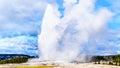 Eruption of the famous Old Faithful Geyser, a Cone Geyser in the Upper Geyser Basin, in Yellowstone National Park Royalty Free Stock Photo