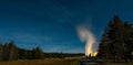 Eruption of Old Faithful geyser at Yellowstone National Park at night Royalty Free Stock Photo