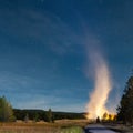 Eruption of Old Faithful geyser at Yellowstone National Park at night Royalty Free Stock Photo