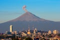 Eruption of Popocatepetl Volcano over the town of Puebla, Mexico, panoramic view Royalty Free Stock Photo