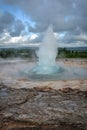 Eruption of Strokkur geyser in Iceland in summer Royalty Free Stock Photo