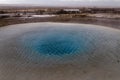 The eruption of the Strokkur geyser in the southwestern part of Iceland in a geothermal area near the river Hvitau