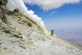 Man standing near volcanic vent on top of Damavand volcano , Iran