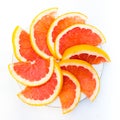 Erved fresh grapefruit composition isolated over the white background, top view