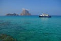 Es Vedra. Ibiza. Spain - 26 may 2018. Water taxi (boat) near the mystical island Royalty Free Stock Photo