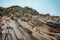 Escalating rock formation with cracks and a blue skyline in the background Royalty Free Stock Photo