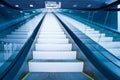 Escalator in blue corridor Royalty Free Stock Photo