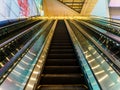 An escalator within a commercial building. Modern / commercial / business concept