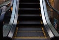 Escalator in Community Mall, Shopping Center. Moving up staircase. electric escalator. Close up to escalators. Close up floor Royalty Free Stock Photo