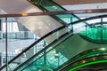 Escalator with green illumination in modern office building Royalty Free Stock Photo