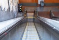 Escalator leading down into a subway tunnel in the daytime Royalty Free Stock Photo