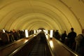 Escalator with people, subway station Borovitskaya