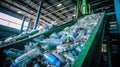 Escalator with a pile of plastic bottles at the factory for processing and recycling. PET recycling plant Royalty Free Stock Photo