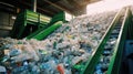 Escalator with a pile of plastic bottles at the factory for processing and recycling. PET recycling plant Royalty Free Stock Photo