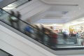 Escalator in the shopping center between the floors. Postprocessing Royalty Free Stock Photo