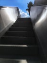 Escalator stairs leading up to sky. Concept of success